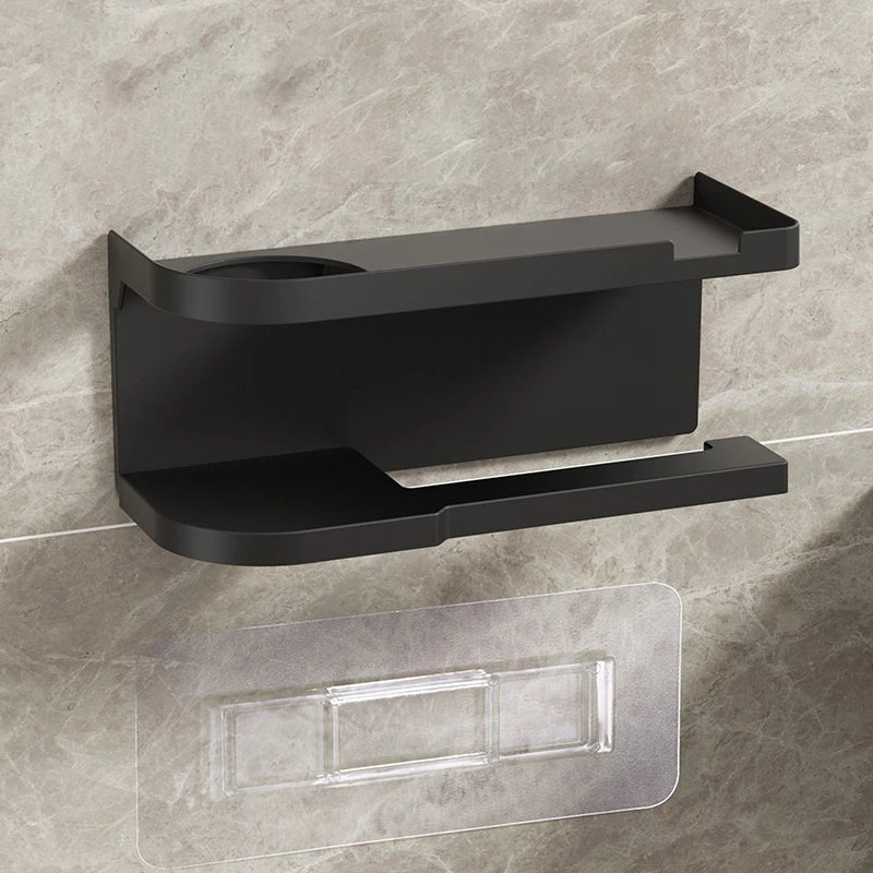 Elevate bathroom refinement with this No-Drill Toilet Paper Holder and Shelf. Wall-mounted organizer discreetly dispenses rolls while showcasing plants, toiletries, or accents.