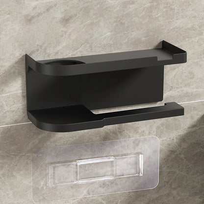 Elevate bathroom refinement with this No-Drill Toilet Paper Holder and Shelf. Wall-mounted organizer discreetly dispenses rolls while showcasing plants, toiletries, or accents.