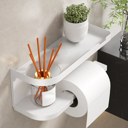 Elevate bathroom refinement with this No-Drill Toilet Paper Holder and Shelf. Wall-mounted organizer discreetly dispenses rolls while showcasing plants, toiletries, or accents.