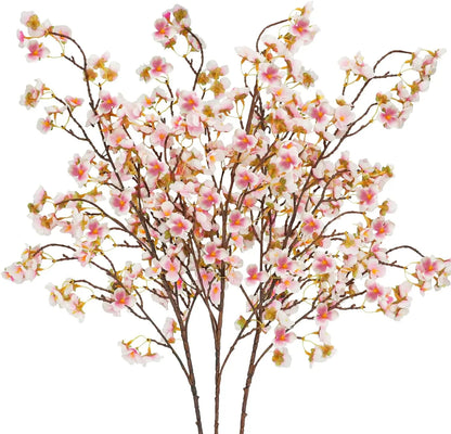 Infuse timeless serenity with these 40in Artificial Cherry Blossom Stems. Lifelike faux sakura branches bring ethereal Japanese elegance to weddings or homes.