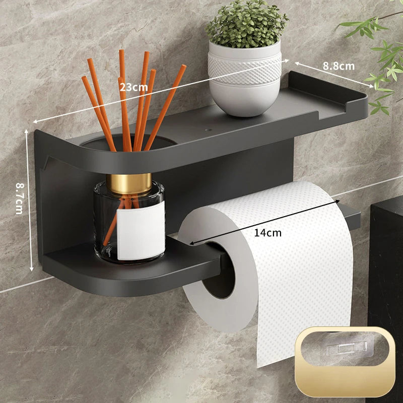 Elevate bathroom refinement with this No-Drill Toilet Paper Holder and Shelf. Wall-mounted organizer discreetly dispenses rolls while showcasing plants, toiletries, or accents.