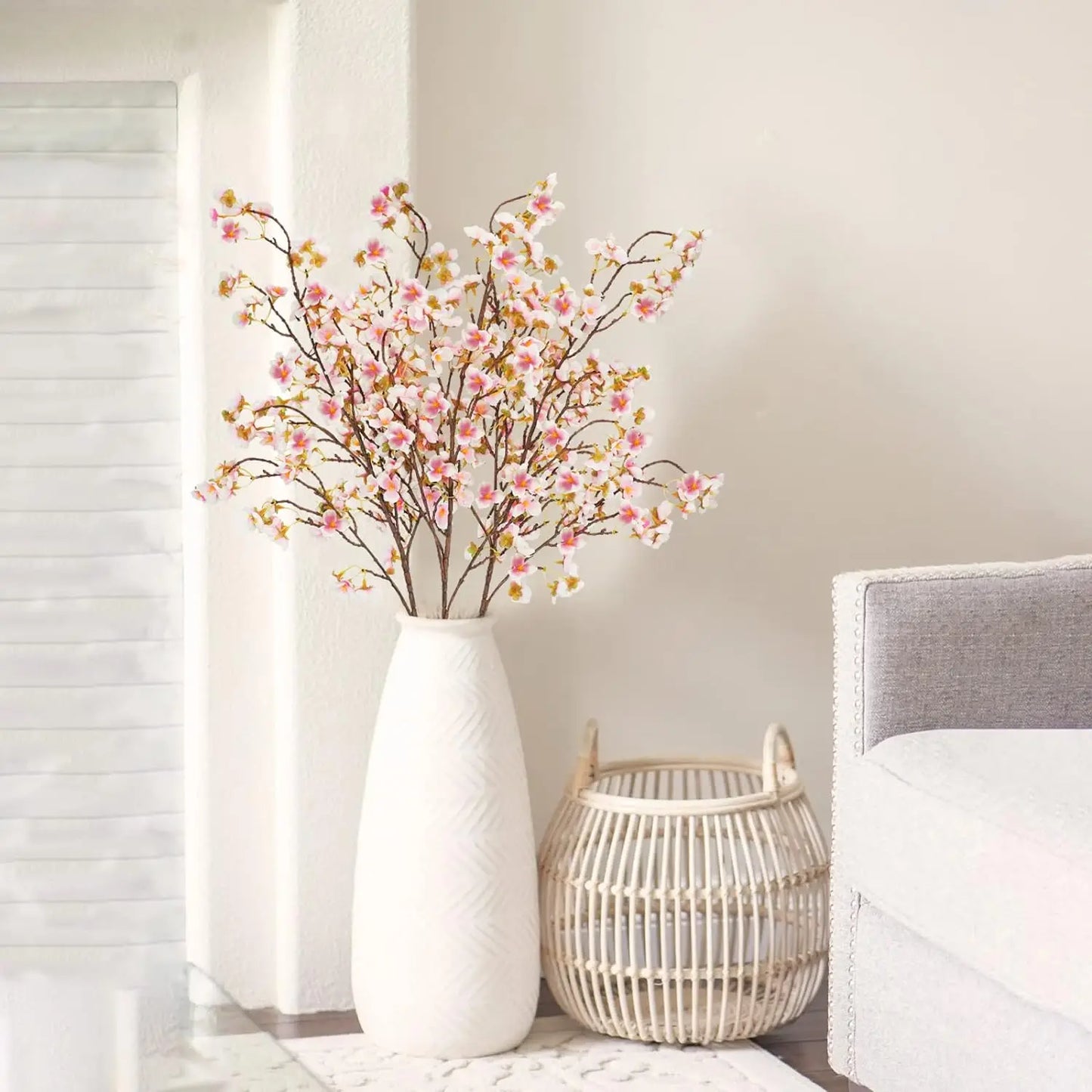 Infuse timeless serenity with these 40in Artificial Cherry Blossom Stems. Lifelike faux sakura branches bring ethereal Japanese elegance to weddings or homes.