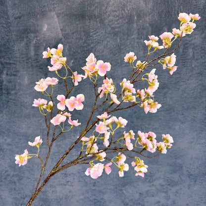 Infuse timeless serenity with these 40in Artificial Cherry Blossom Stems. Lifelike faux sakura branches bring ethereal Japanese elegance to weddings or homes.